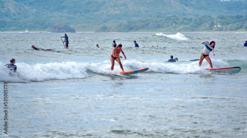 Surfer on the beach in Tamarindo, Costa Rica © Angela
