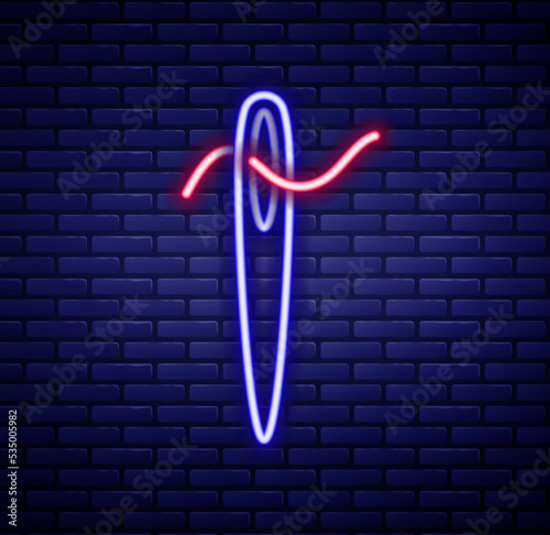 Glowing neon line Needle for sewing with thread icon isolated on brick wall background. Tailor symbol. Textile sew up craft sign. Embroidery tool. Colorful outline concept. Vector