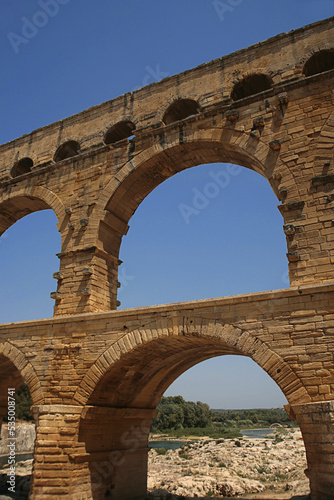 Pont du Gard  Gard  Occitanie  France  famous Roman aqueduct over Gardon river  close-up detail of the upper tiers of arches
