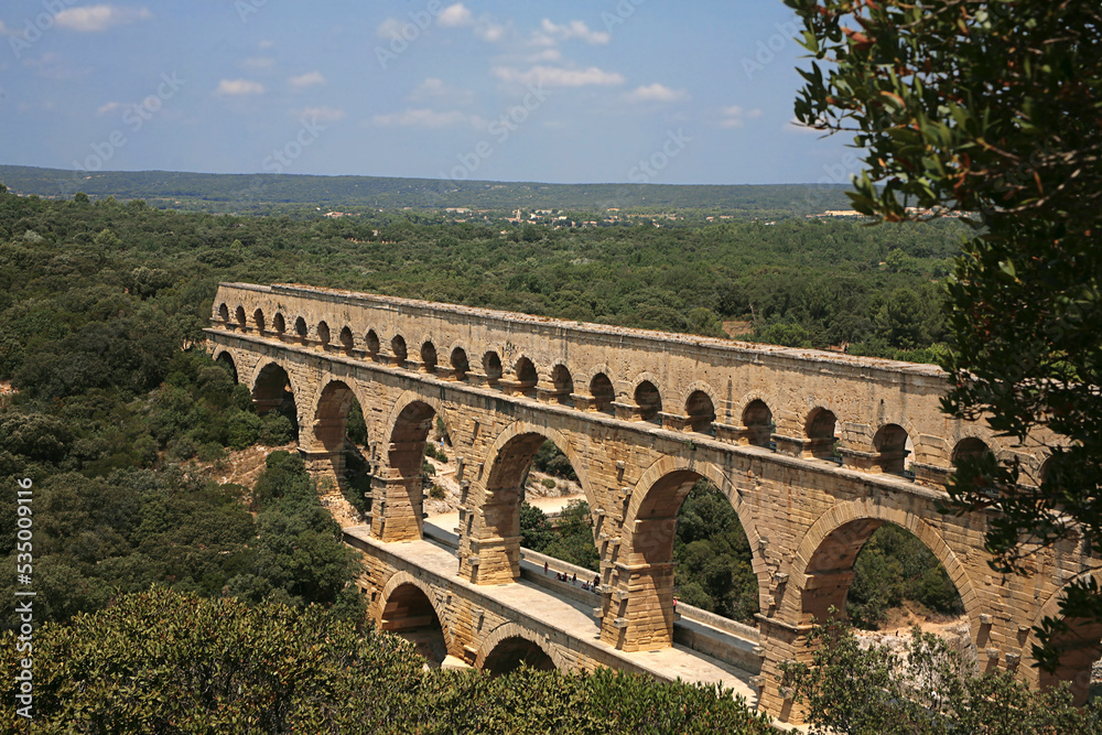 Pont du Gard, Gard, Occitanie, France: famous Roman aqueduct over Gardon river: general view from south bank