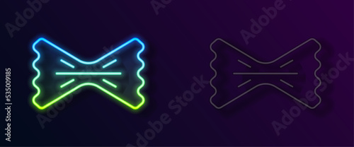 Glowing neon line Macaroni icon isolated on black background. Italian cuisine. Vector