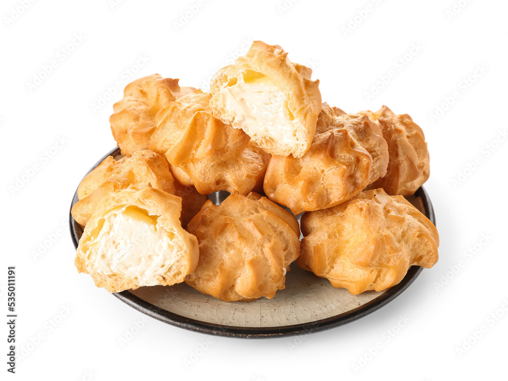 Plate with tasty round eclairs on white background