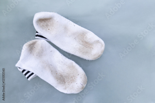 dirty stain on socks from using in daily life activity for cleaning concept. selective focus image.
