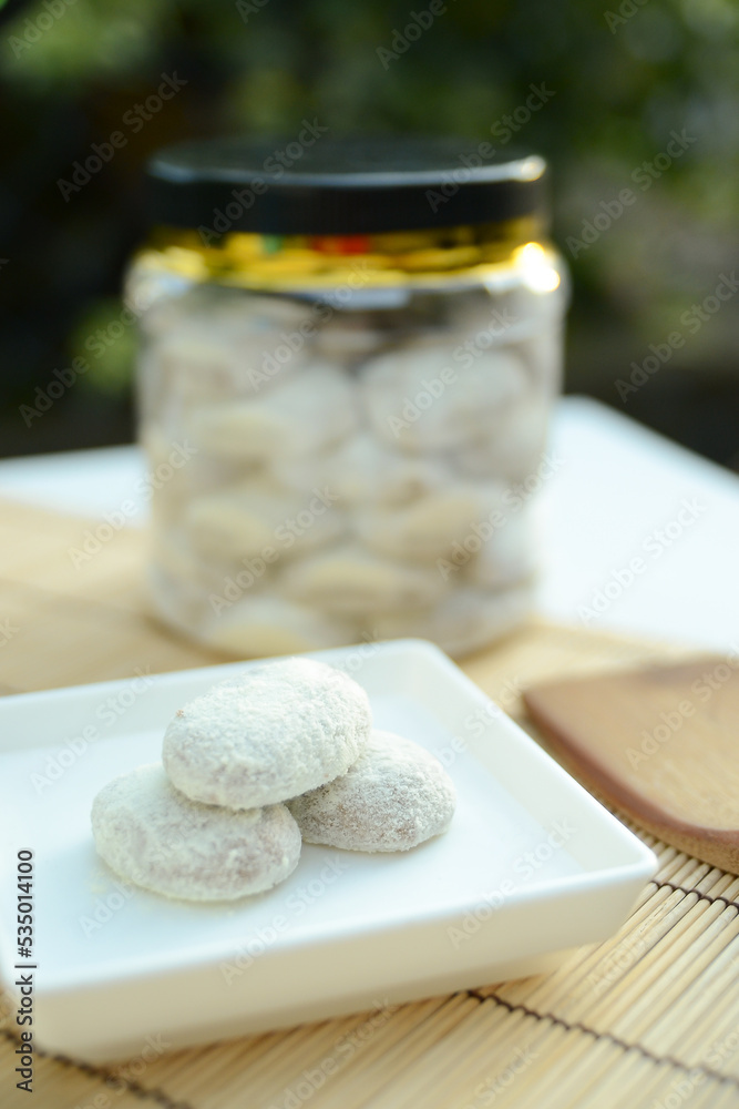 Putri salju cookie is a kind of kue kering from Malaysia which is crescent-shaped and coated with powdered sugar covered like snow. View with copy space.