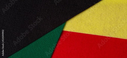 Geometric felt fabric textile background in black, red, yellow, green colors. Black History Month color background with copy space for text.