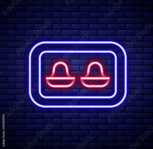 Glowing neon line Earplugs with storage box icon isolated on brick wall background. Ear plug sign. Noise symbol. Sleeping quality concept. Colorful outline concept. Vector