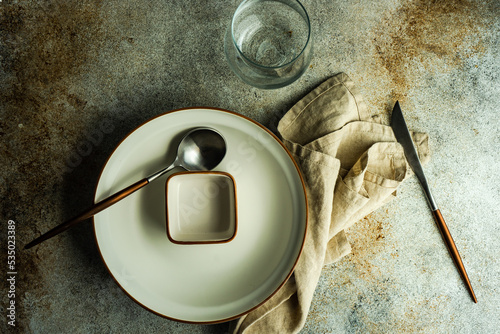 Overhead view of a rustic place setting on a table
