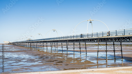 Southport Pier reflecting in pools of water photo
