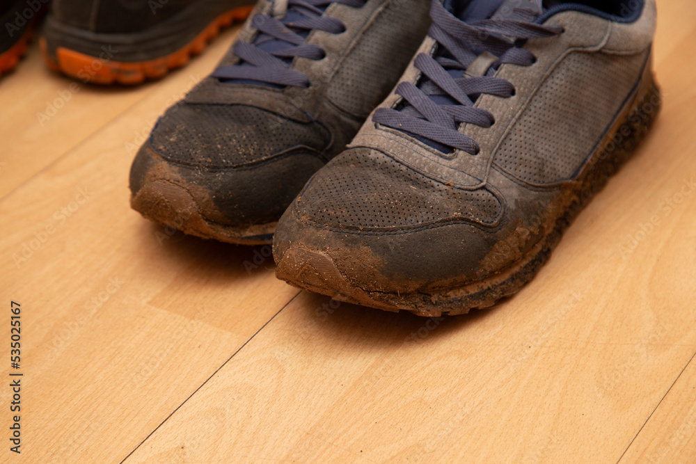 Dirty shoes after walking on the street.Cleaning dirty shoes.