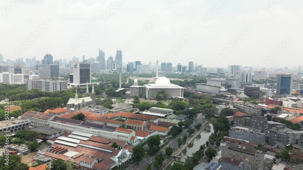 Aerial view clip of National Monument as known as Monas, and the Masjid Istiqlal, the biggest Mosque, located in Jakarta, the capital city of Indonesia, 4K resolution