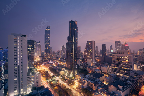 Night view of urban skyline. Downtown with skyscrapers and modern architecture. Bangkok, Thailand. photo