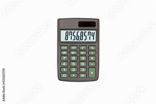 Calculator with brown buttons with numbers on the digital screen on a white background. Isolated. Solar powered financial calculator. Electronic machine for math. Business office supplies. Close-Up