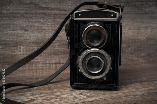 Vintage camera on wooden background photo