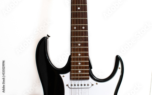 Black and white electrical guitar isolated on white background, musical instrument, hobby and business