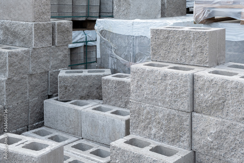 Stack of cement concrete Building cinder blocks brick on pallete in hardware store photo