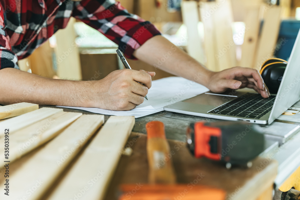 Hands of person doing diy project at home. Man measuring wood to doing cabinet craftworks as a hobby. Hands of person doing diy project at home. Man measuring wood to doing cabinet craftworks as a hobby.
