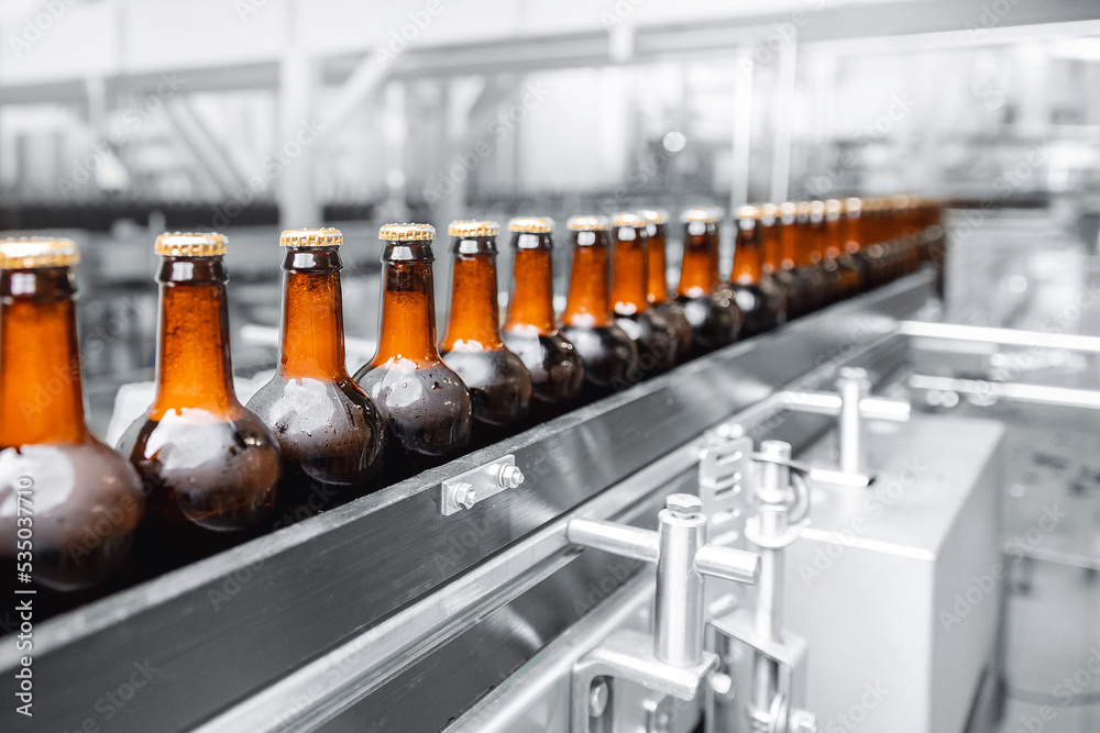Glass bottles of beer on dark background. Concept banner brewery plant ...