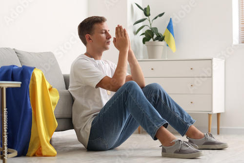Young man with flag of Ukra...