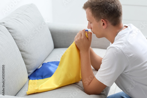 Young man with flag of Ukra...