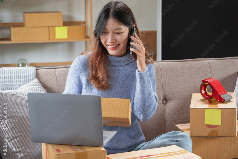 Young Asian SME businessman starting a small and boxed SME business as an online business. Online SME business concept. Young Asian SME businessman starting a small and boxed SME business as an online business. Online SME business concept.