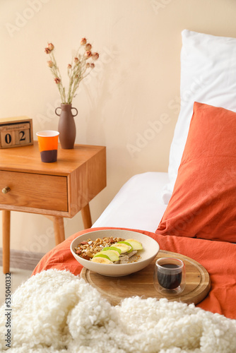 Wooden board with bowl of t...