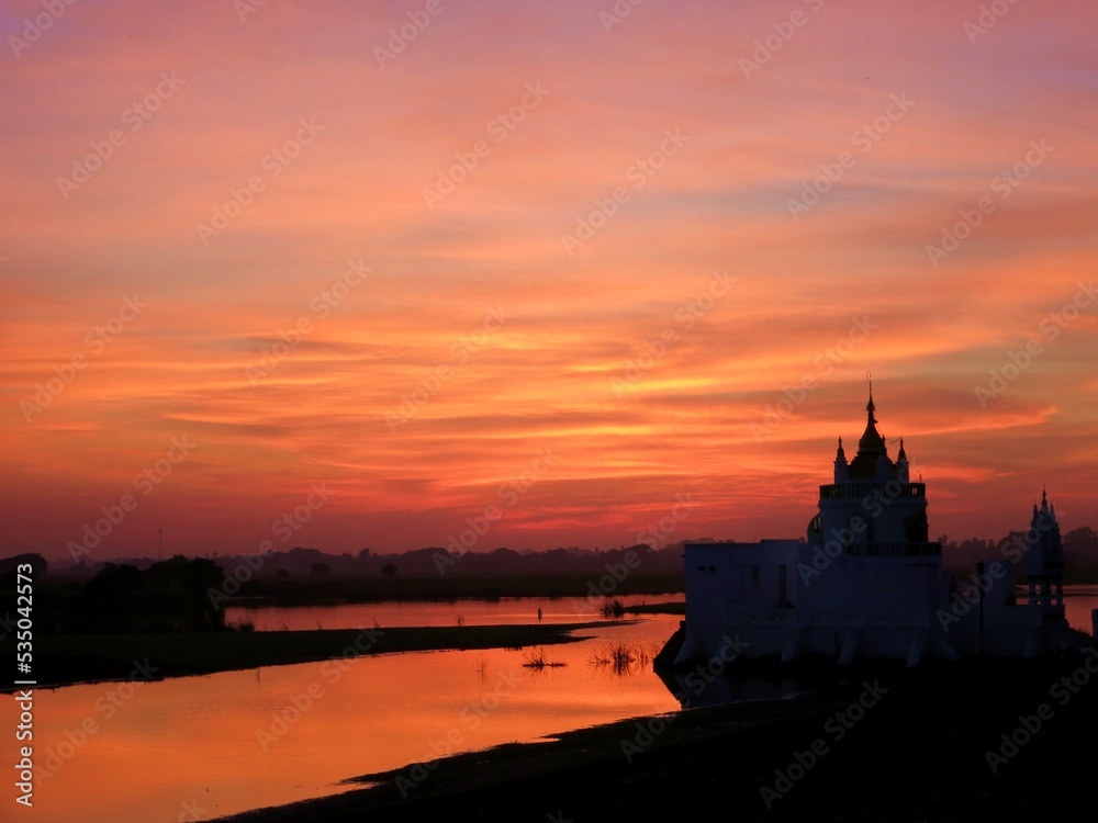 sunset over the river in myanmar