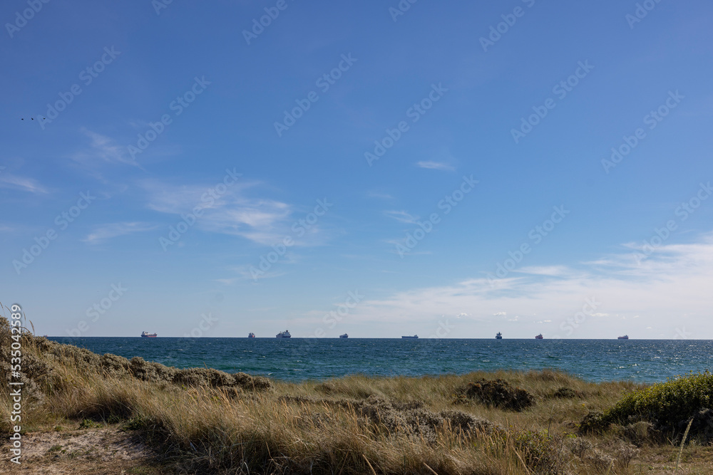 Ships on the horizon-Skagens Odde, English  Scaw Spit or The Skaw)is a sandy peninsula   the northernmost area of Vendsyssel in Jutland, Denmark.,Europe