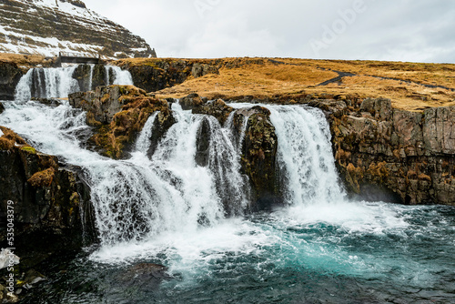 Close-up of the picturesque Kirkjufellsfoss waterfall near the famous Kirkjufell mountain on the north coast of the Sn  fellsnes peninsula  near Grundarfj  r  ur  Iceland