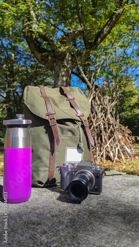 backpack, camera and thermos of water for the adventure

