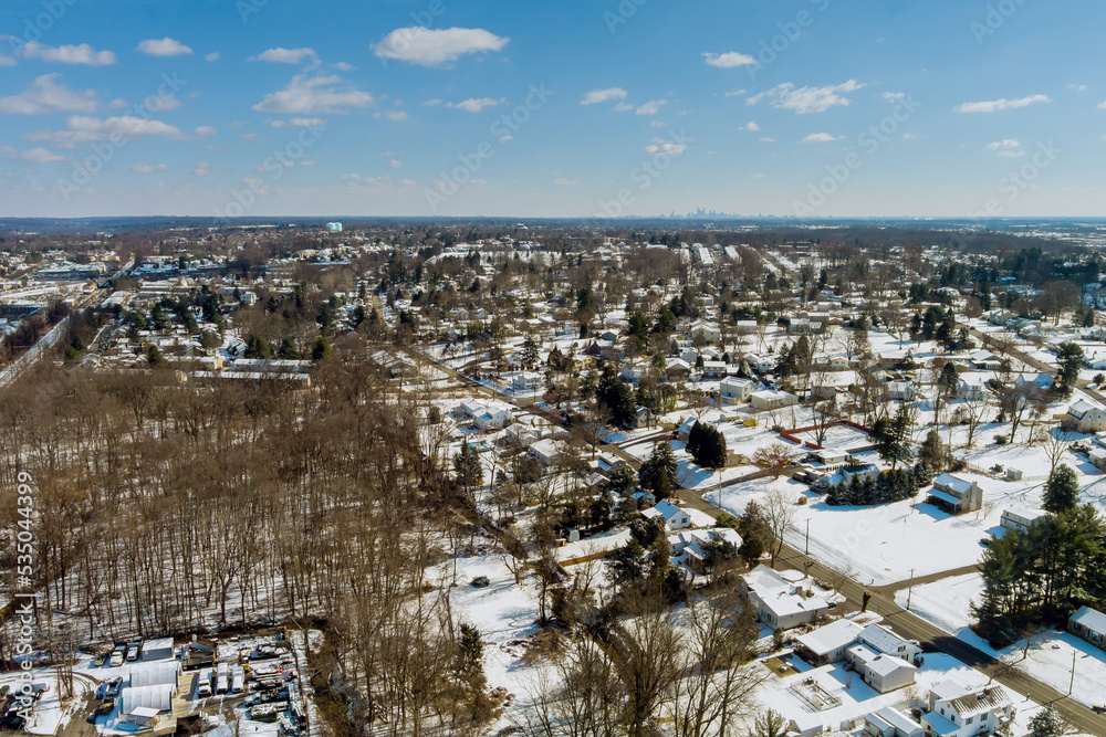 A small American town in Pennsylvania has residential complex with snowy home roof after heavy snowstorm that occurred