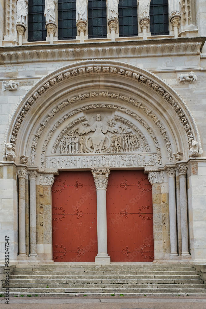 The main portal with a 19th-century tympanum depicting the final judgement of the medieval basilica Sainte-Marie-Madeleine in Vézelay, Burgundy, Morvan, France, a Unesco wold heritage site.
