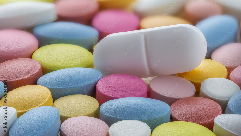 Tablets of different colors. Antibiotic resistance. Tablets from antimicrobial viruses. Pharmaceutical industry.. Tablets of different colors. Antibiotic resistance. Tablets from antimicrobial viruses. Pharmaceutical industry..