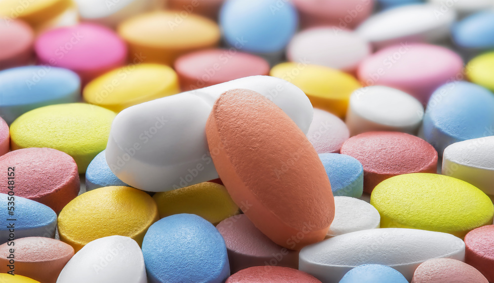 Tablets of different colors. Antibiotic resistance. Tablets from antimicrobial viruses. Pharmaceutical industry.. Tablets of different colors. Antibiotic resistance. Tablets from antimicrobial viruses. Pharmaceutical industry..