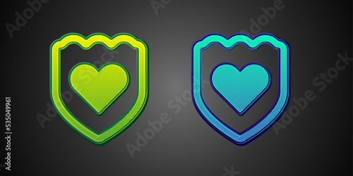 Green and blue Immune system icon isolated on black background. Medical shield. Vector