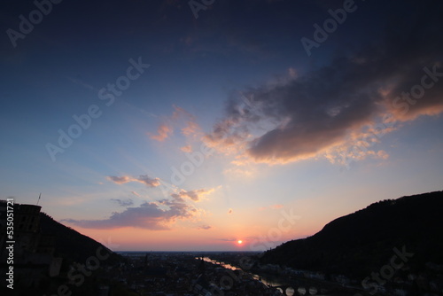 View over Heidelberg in the evening. Sunset on the horizon  view over the old town  the castle and the river Neckar on a warm summer day