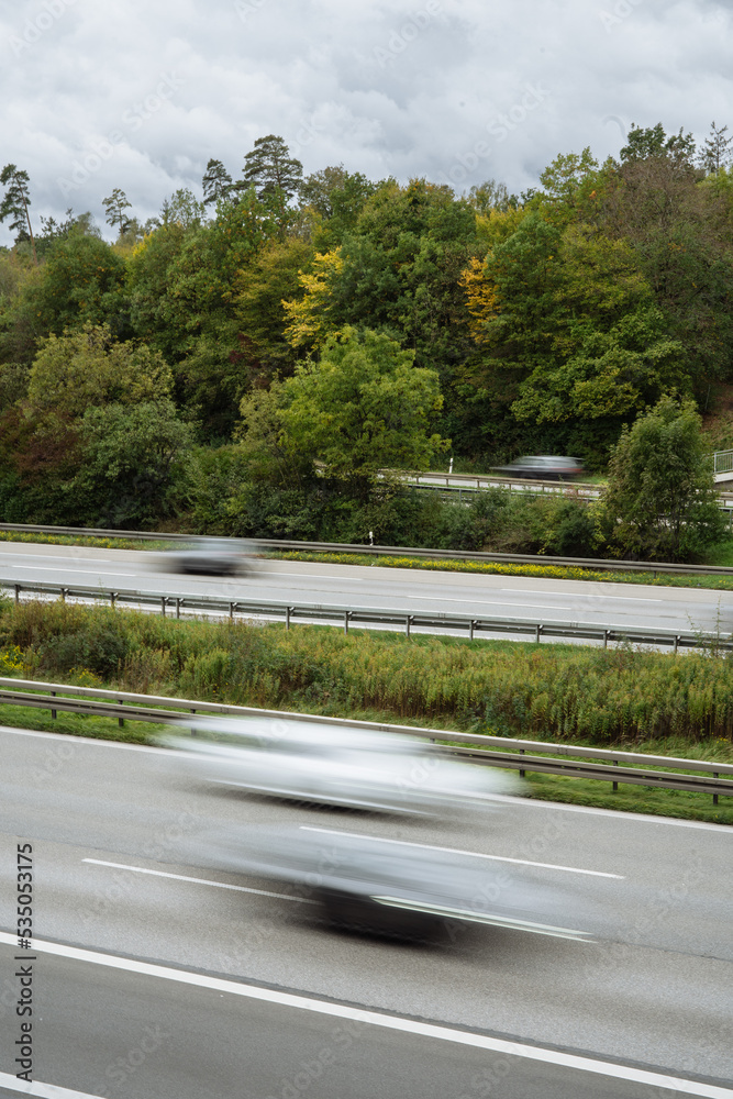 Fast cars on a highway Fast cars on a highway