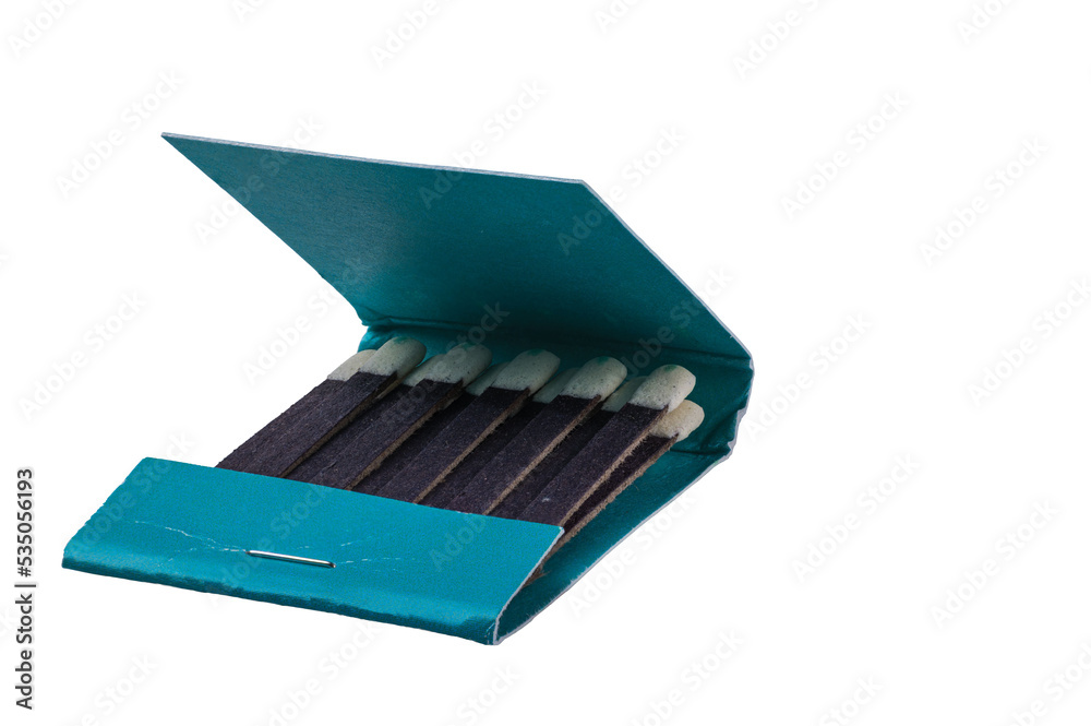 Close up view of matches in green pack on white background isolated. Close up view of matches in green pack on white background isolated.