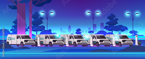 electric cargo vans charging battery vehicles at recharging power station charger EV management sustainable transport