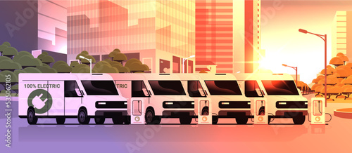 electric cargo vans charging battery vehicles at recharging power station charger EV management sustainable transport