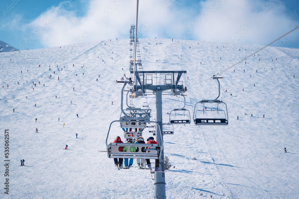 Chair lift in the ski resort of Bansko, Bulgaria. Winter landscape in the Pirin mountains Chair lift in the ski resort of Bansko, Bulgaria. Winter landscape in the Pirin mountains