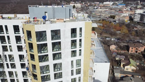 Building external wall thermal insulation with mineral wool. Exterior passive house wall heat insulation with mineral wool. Insulation the facade of commercial building. Energy efficiency
