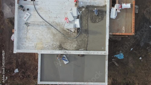 Roofing construction worker installing a flat roof. 
