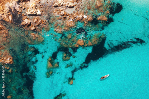 Beautiful summer seascape from air. Turquoise sea water with sup and rocks from top view, Islands of sardinia in Italy. Vacation background © kucherav