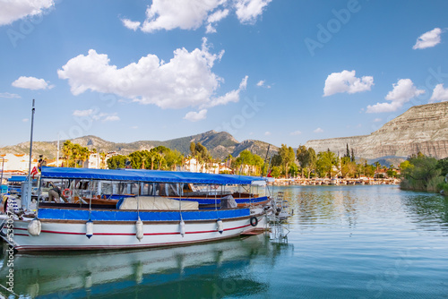 Fototapeta Naklejka Na Ścianę i Meble -  Touristic river boats with tourists in Dalyan resort, Turkey