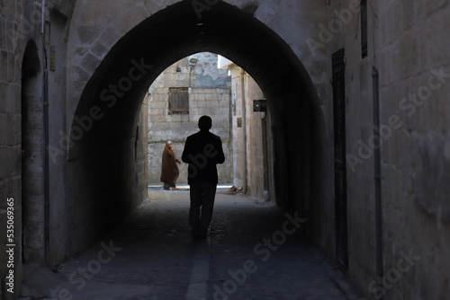 silhouette of a person in a corridor © MehmetAli