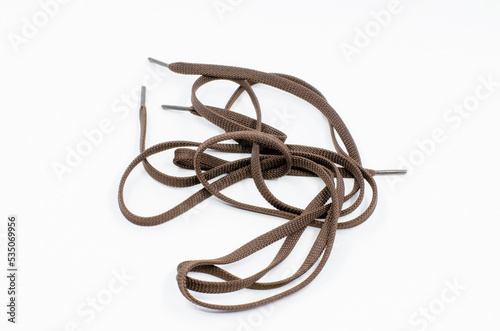 shoelaces on a white isolated background. Brown shoelaces. 