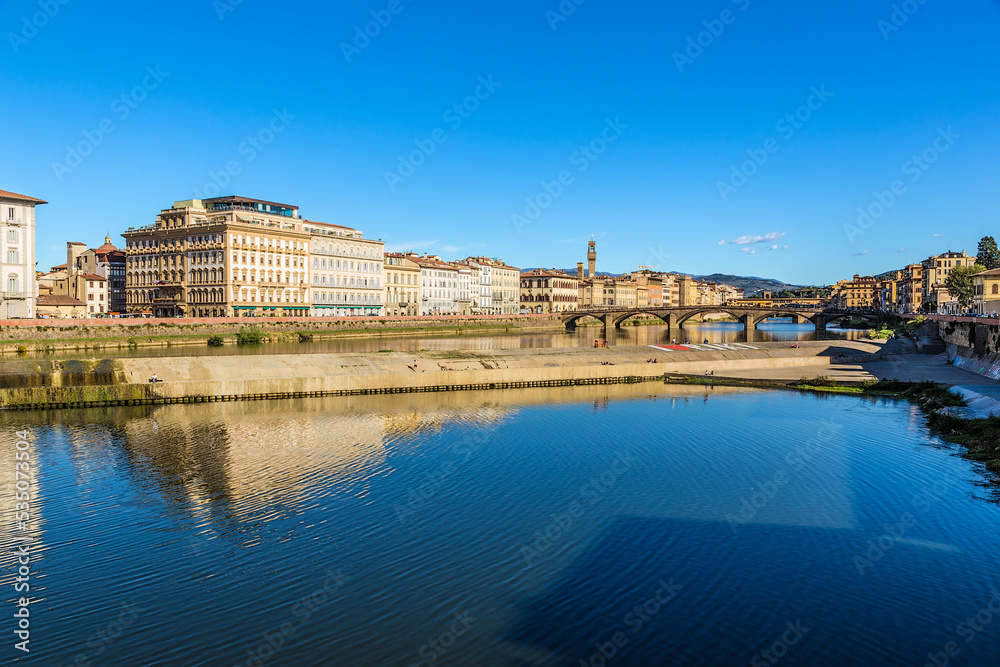 Florence, Italy. Scenic view of the Arno river with a dam and bridges