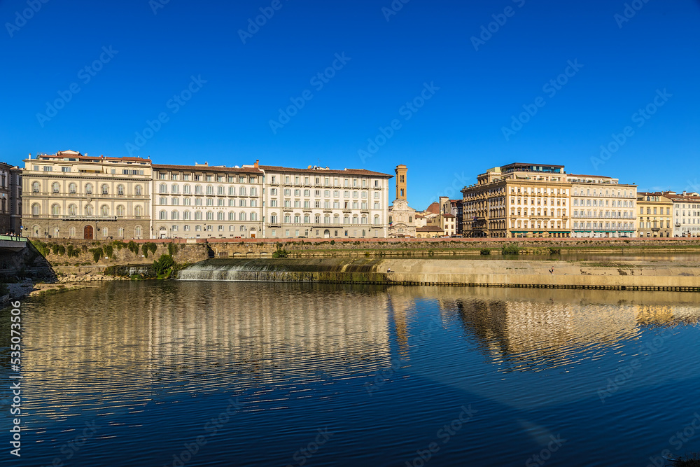 Florence, Italy. Picturesque landscape with a dam on the Arno river 