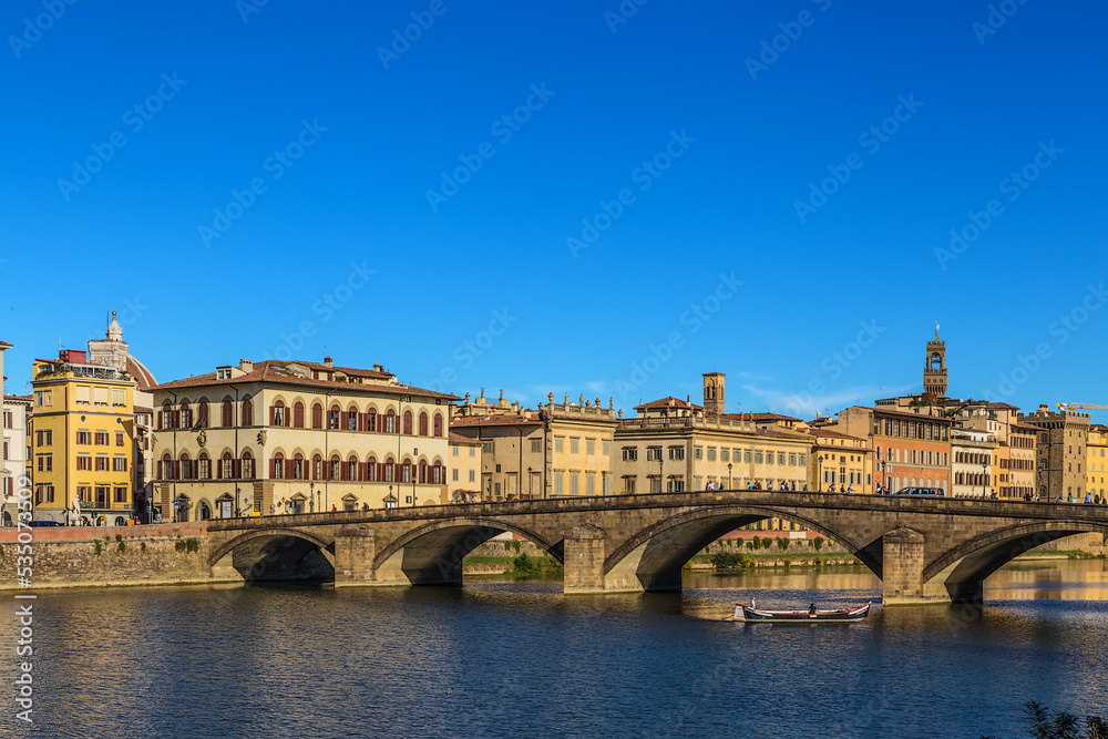 Florence, Italy. Scenic view of the embankment of the Arno River and the Ponte alla Carraia bridge