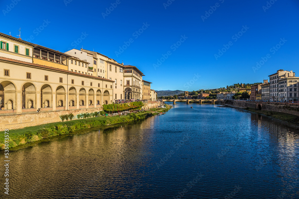 Florence, Italy. Scenic view of the embankment of the Arno river with medieval buildings